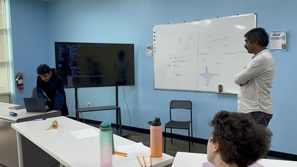Students participating in Python summer camp activities at Y2L Academy.